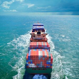 Aerial view of freight ship with cargo containers on the sea. See similar photos: :  http://www.oc-photo.net/FTP/icons/cargo.jpg