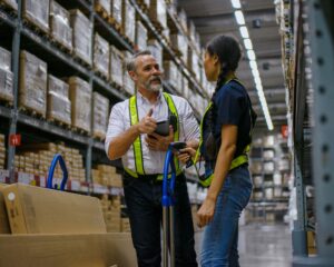 Logistics employees are working warehouse.