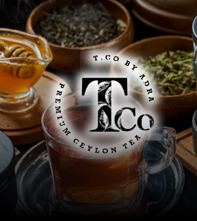 Glass teapot with warmer, with hot herbal tea on table on restau