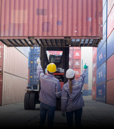 Glass teapot with warmer, with hot herbal tea on table on restau